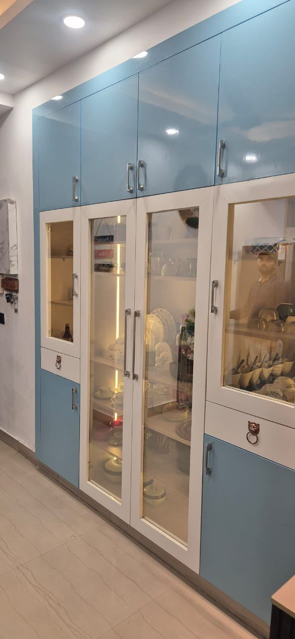 Crockery Unit with Glass Shutters: Kitchens by Supreme Kitchens, Noida