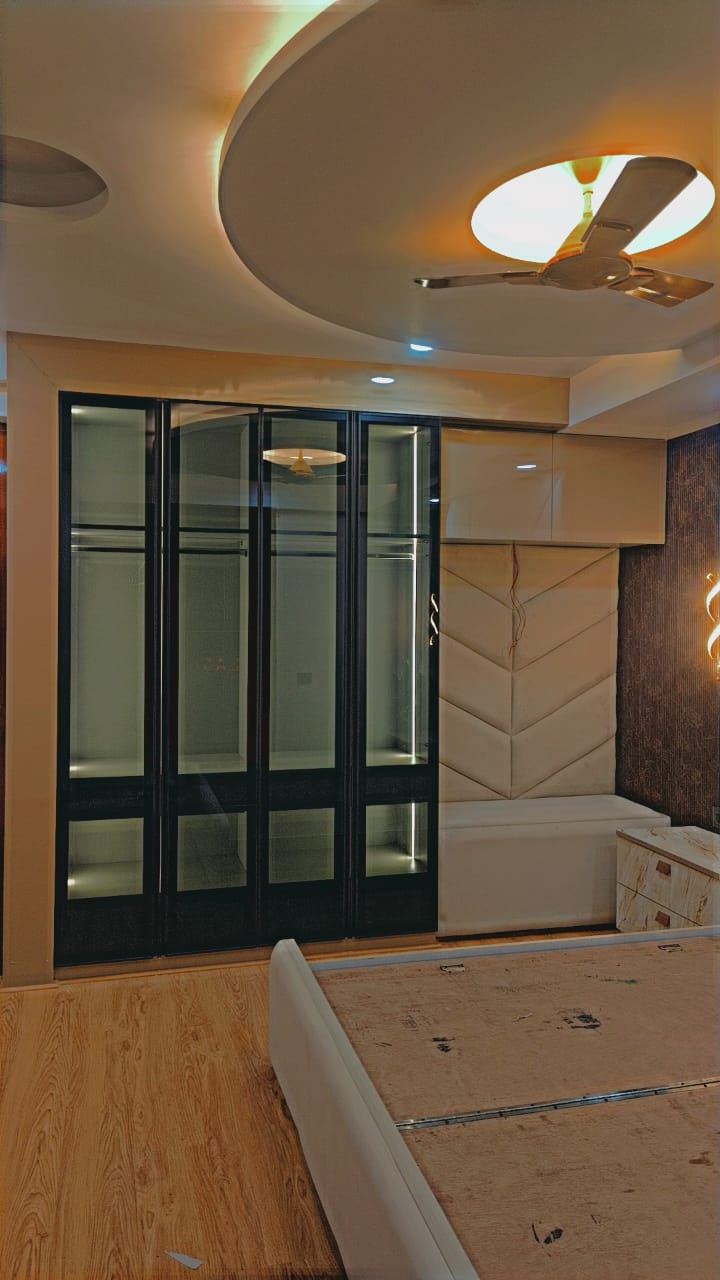 Glass Display Unit & Designer Ceiling: Living & TV Units by Supreme Kitchens, Noida