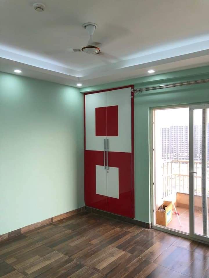 Red & White Hinged Wardrobe: Wardrobes by Supreme Kitchens, Noida
