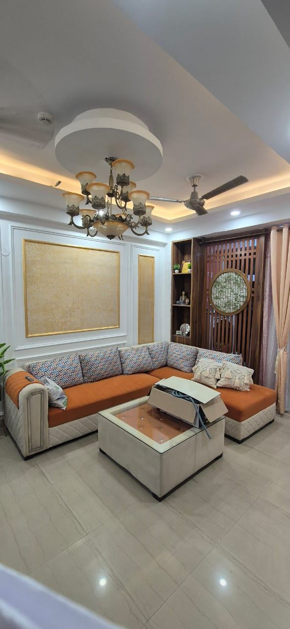 Living Room with Chandelier Ceiling: Living & TV Units by Supreme Kitchens, Noida