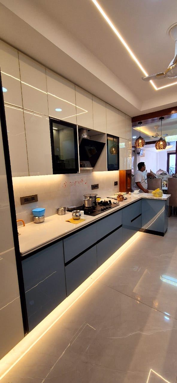 Parallel Modular Kitchen with Profile Lighting: Kitchens by Supreme Kitchens, Noida