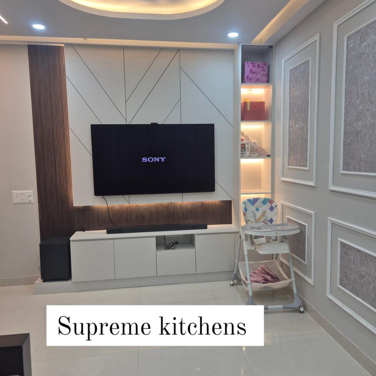 TV Unit with Wall Panelling: Living & TV Units by Supreme Kitchens, Noida